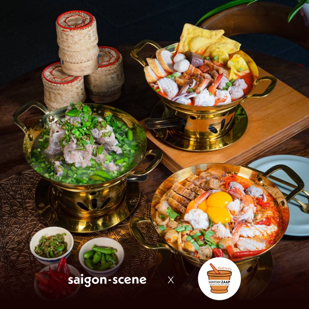 Isan Thai hotpots, sticky rice baskets and fresh chillies on the table at Somtam ZAAP